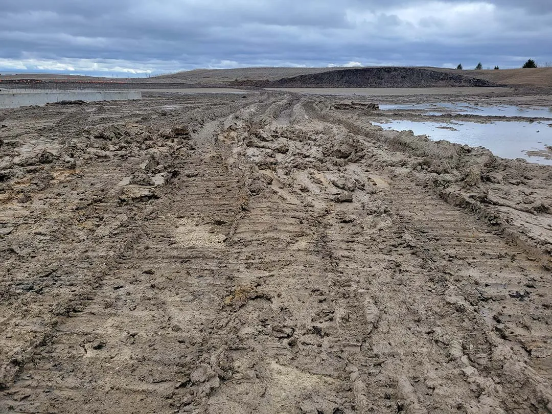 Rutted soft-soil subgrade before stabilization on a jobsite