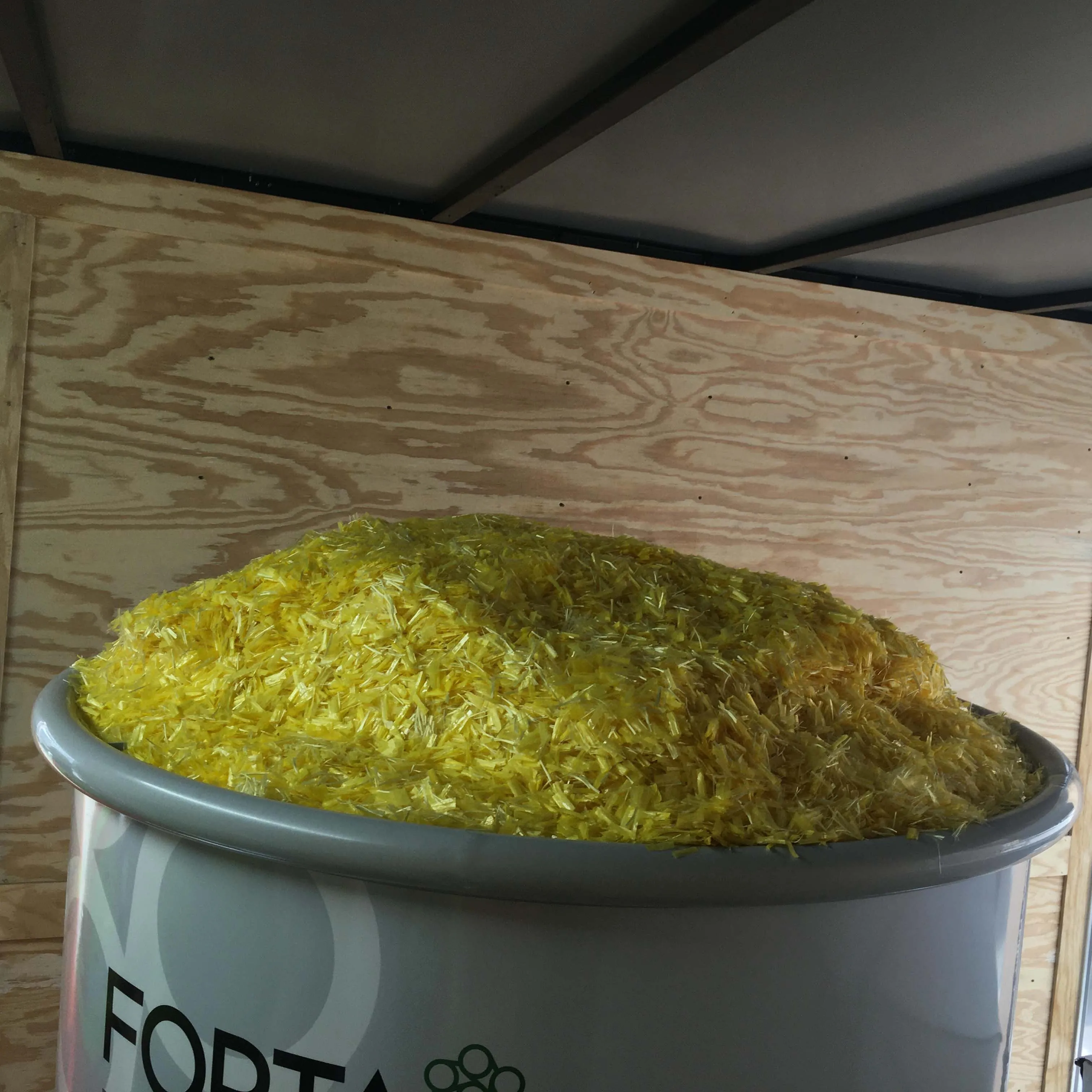 FORTA‑FI aramid and polyolefin fiber blend in a dosing bin